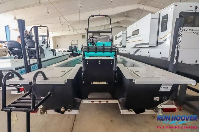 Slide: The Image of 2025 Majek 18 M2 boat displayed at Ron Hoover RV & Marine Centers showroom. - 5