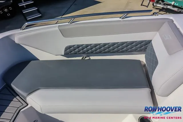 Slide: The Image of 2025 Starcraft SVX171 boat interior with gray cushioned seating and diamond-patterned accents. - 15
