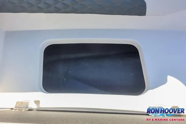 Slide: The Image of 2025 Starcraft SVX171 storage compartment with quilted interior, Ron Hoover RV & Marine Centers logo. - 17