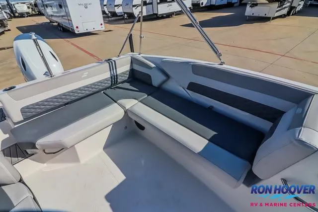 Slide: The Image of 2025 Starcraft SVX171 boat interior with gray seating, displayed at Ron Hoover RV & Marine Centers. - 18