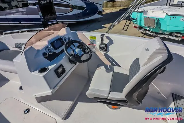 Slide: The Image of 2025 Starcraft SVX171 boat cockpit with steering wheel and control panel. - 19