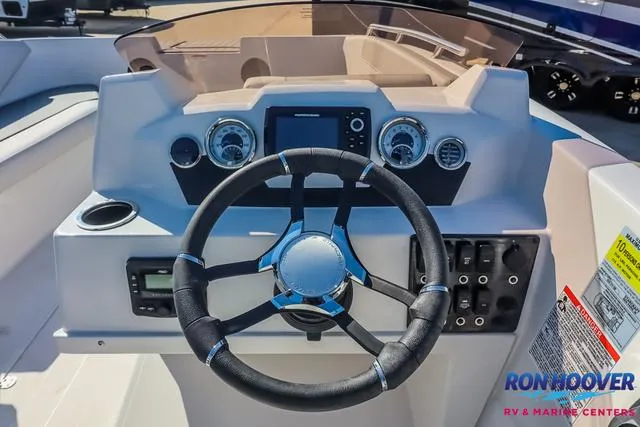 Slide: The Image of 2025 Starcraft SVX171 boat dashboard with steering wheel and control panel. - 20