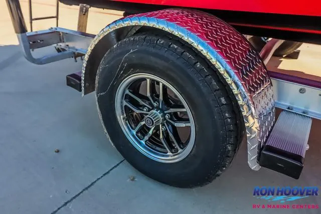 Slide: The Image of 2025 Starcraft SVX171 trailer wheel with chrome fender, displayed at Ron Hoover RV & Marine Centers. - 28