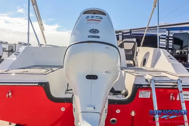 Slide: The Image of 2025 Starcraft SVX171 boat with a 115 horsepower engine, red and white design. - 32