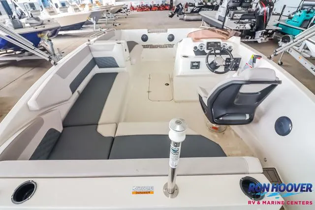 Slide: The Image of 2025 Starcraft SVX171 boat interior with seating and steering console at Ron Hoover RV & Marine Centers. - 10
