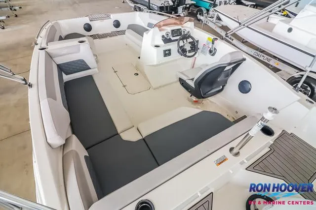 Slide: The Image of 2025 Starcraft SVX171 boat interior with spacious seating and modern dashboard, displayed at Ron Hoover RV & Marine Centers. - 12