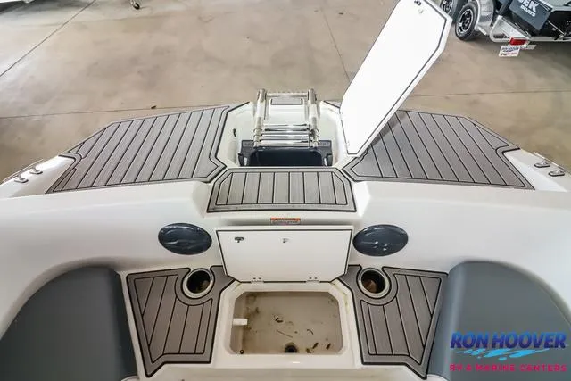 Slide: The Image of 2025 Starcraft SVX171 boat deck with storage compartment and ladder. - 14