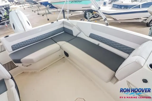 Slide: The Image of 2025 Starcraft SVX171 boat interior with gray seating, displayed at Ron Hoover RV & Marine Centers. - 18