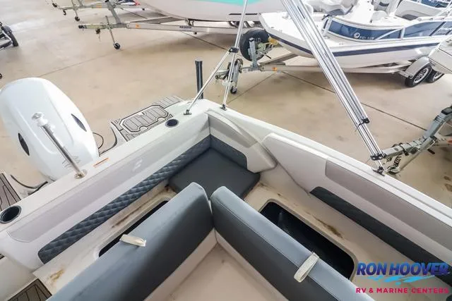 Slide: The Image of 2025 Starcraft SVX171 boat interior with seating, motor, and storage compartments at Ron Hoover RV & Marine Center. - 19