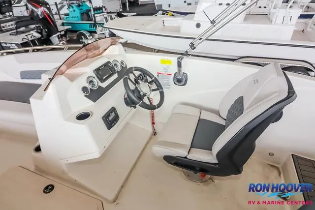 Slide: The Image of 2025 Starcraft SVX171 boat interior with steering console and seating at Ron Hoover RV & Marine Center. - 21