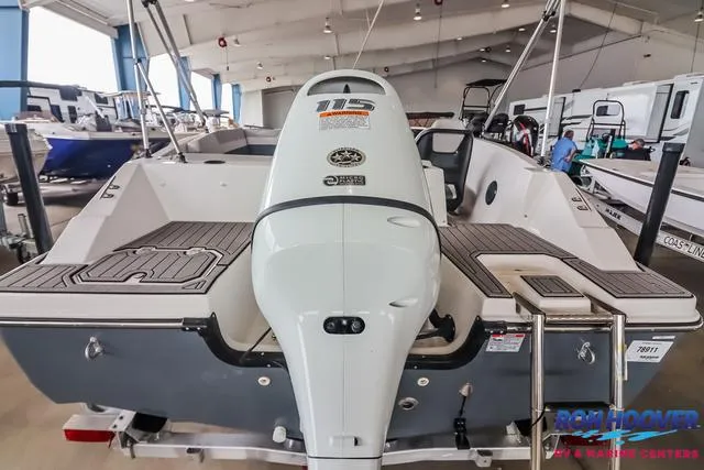 Slide: The Image of 2025 Starcraft SVX171 boat with outboard motor in a showroom. - 31