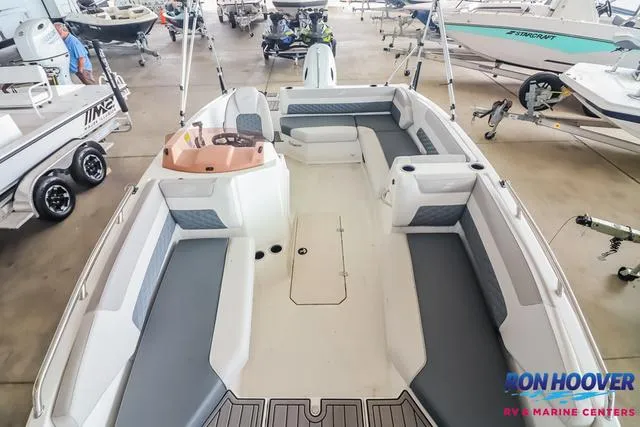 Slide: The Image of 2025 Starcraft SVX171 boat interior with gray seating, displayed at Ron Hoover RV & Marine Centers. - 7
