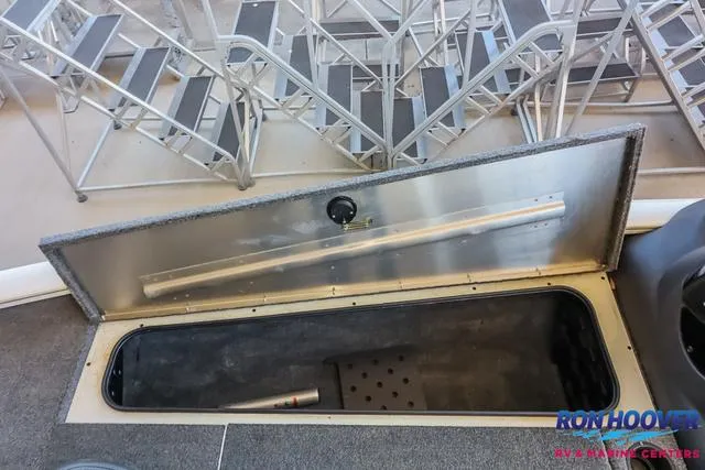 Slide: The Image of 2021 Tracker Pro Team 190 TX TE boat storage compartment open, showcasing interior space. - 16