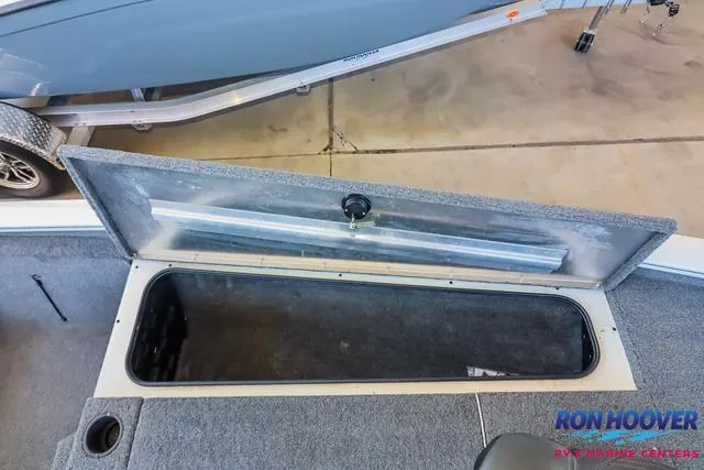 Slide: The Image of Open storage compartment on 2021 Tracker Pro Team 190 TX TE boat. - 17