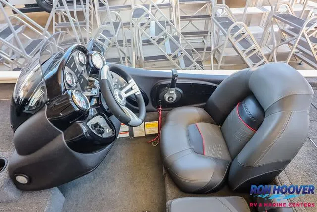 Slide: The Image of 2021 Tracker Pro Team 190 TX TE boat interior with steering wheel and seat. - 19