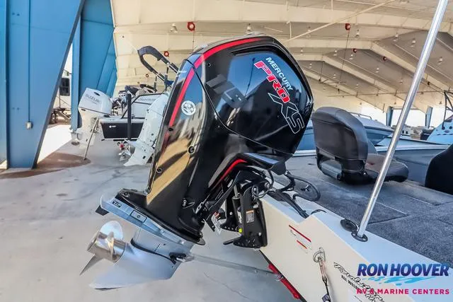 Slide: The Image of 2021 Tracker Pro Team 190 TX TE boat with Mercury Pro XS engine in showroom. - 26