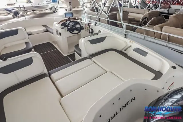 Slide: The Image of 2020 Bayliner Element E18 boat interior with seating and steering console. - 13