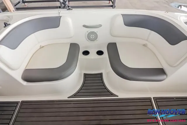 Slide: The Image of 2020 Bayliner Element E18 boat interior with gray seating and cup holders. - 16