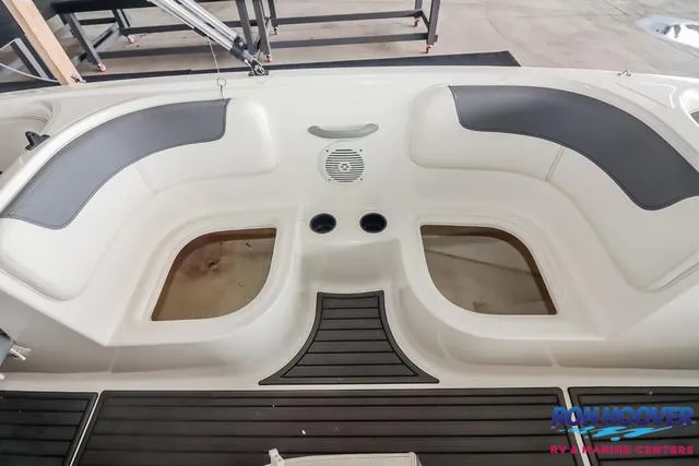 Slide: The Image of 2020 Bayliner Element E18 boat interior with seating and cup holders. - 17