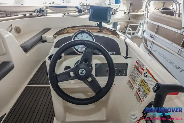 Slide: The Image of 2020 Bayliner Element E18 boat dashboard with steering wheel and navigation system. - 19