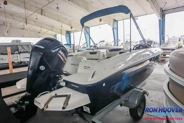 Slide: The Image of 2020 Bayliner Element E18 boat with Mercury engine in indoor showroom. - 7