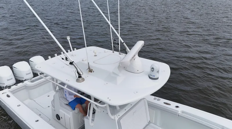 Slide: The Image of 2017 Yellowfin 36 Offshore boat on water, featuring multiple outboard engines. - 11