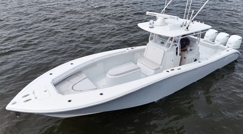 Slide: The Image of 2017 Yellowfin 36 Offshore boat cruising on open water. - 12
