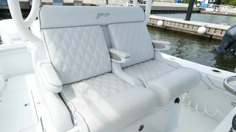 Slide: The Image of Luxurious seating on a 2017 Yellowfin 36 Offshore boat, featuring diamond-stitched upholstery. - 20