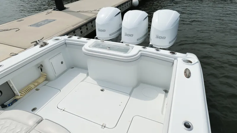 Slide: The Image of 2017 Yellowfin 36 Offshore boat with triple 300 horsepower engines at dock. - 22