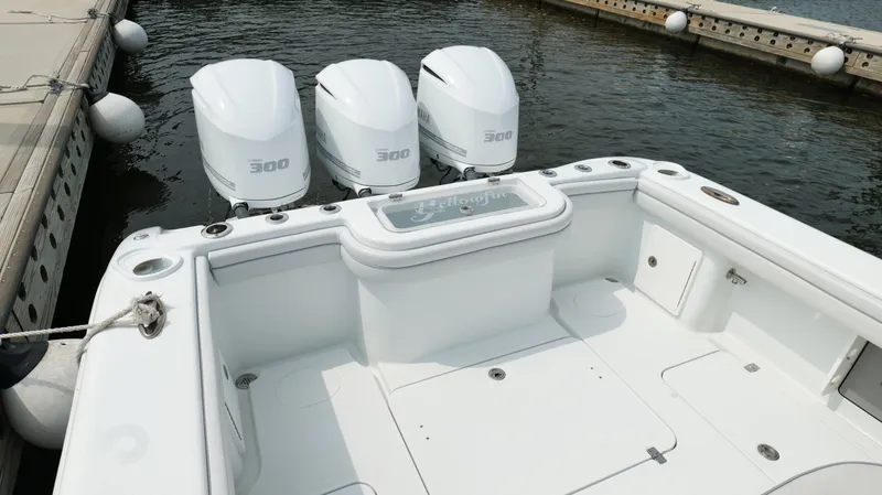 Slide: The Image of 2017 Yellowfin 36 Offshore boat with triple 300 horsepower engines docked at marina. - 23