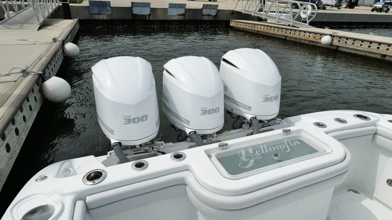 Slide: The Image of 2017 Yellowfin 36 Offshore boat with triple 300 horsepower engines docked at marina. - 24
