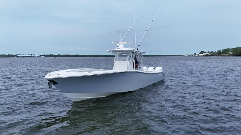Slide: The Image of 2017 Yellowfin 36 Offshore boat on calm waters, featuring sleek design and fishing equipment. - 3