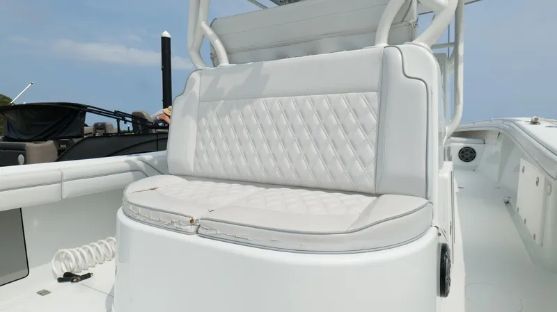 Slide: The Image of 2017 Yellowfin 36 Offshore boat with white cushioned seating and sleek design. - 31