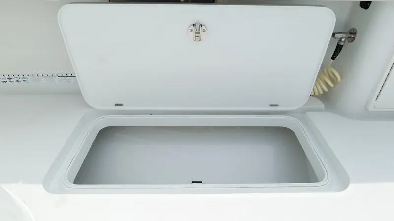 Slide: The Image of Open storage compartment on a 2017 Yellowfin 36 Offshore boat. - 32