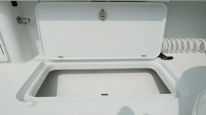 Slide: The Image of Open storage compartment on a 2017 Yellowfin 36 Offshore boat. - 34