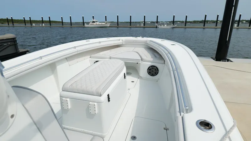 Slide: The Image of 2017 Yellowfin 36 Offshore boat docked, featuring spacious seating and sleek design. - 37