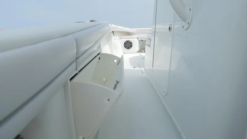 Slide: The Image of 2017 Yellowfin 36 Offshore boat interior with white storage compartments and sleek design. - 38