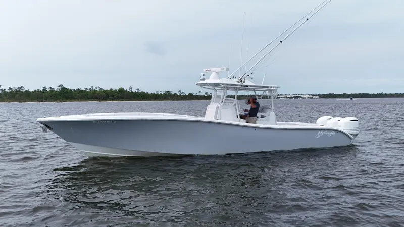 Slide: The Image of 2017 Yellowfin 36 Offshore boat on calm water, side view. - 4
