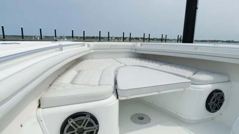 Slide: The Image of 2017 Yellowfin 36 Offshore boat with cushioned seating and speakers. - 46