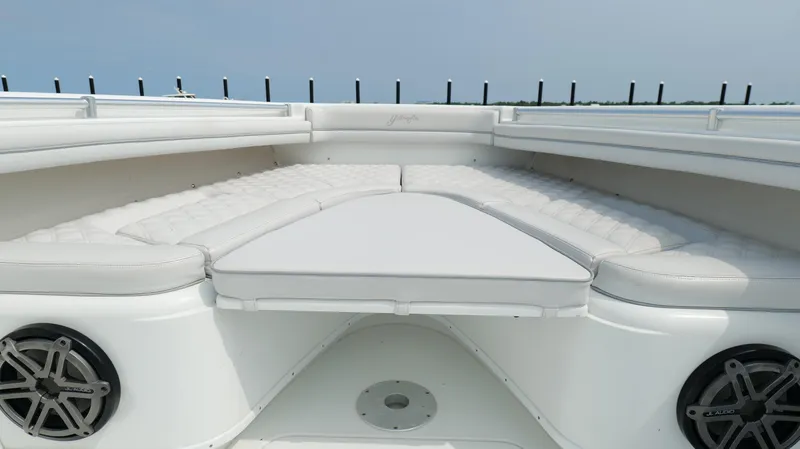 Slide: The Image of 2017 Yellowfin 36 Offshore boat with cushioned seating and built-in speakers. - 47