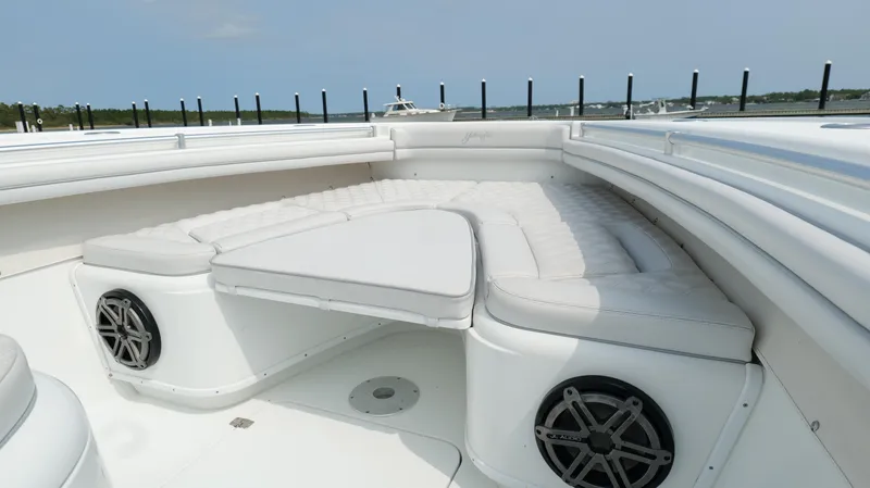 Slide: The Image of 2017 Yellowfin 36 Offshore boat with cushioned seating and speakers on deck. - 48