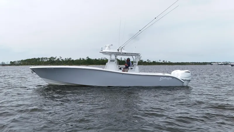 Slide: The Image of 2017 Yellowfin 36 Offshore boat on calm water, side view. - 5