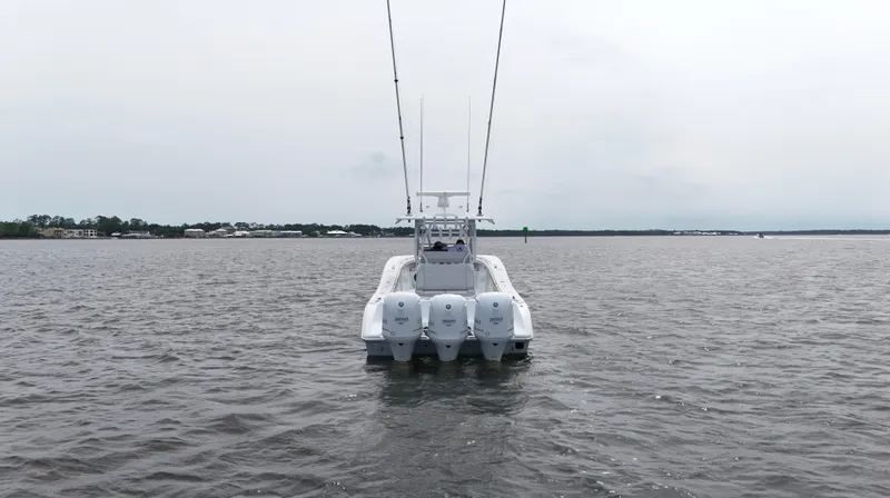 Slide: The Image of 2017 Yellowfin 36 Offshore boat on open water, rear view. - 7