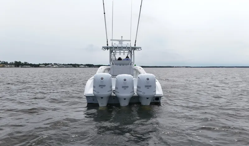 Slide: The Image of 2017 Yellowfin 36 Offshore boat with triple engines on open water. - 8