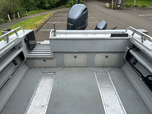 Slide: The Image of 2017 Duckworth Pacific Pro 22' boat interior with storage compartments and outboard motor. - 10