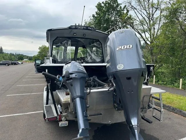 Slide: The Image of 2017 Duckworth Pacific Pro 22' boat with dual Yamaha outboard motors in a parking lot. - 3