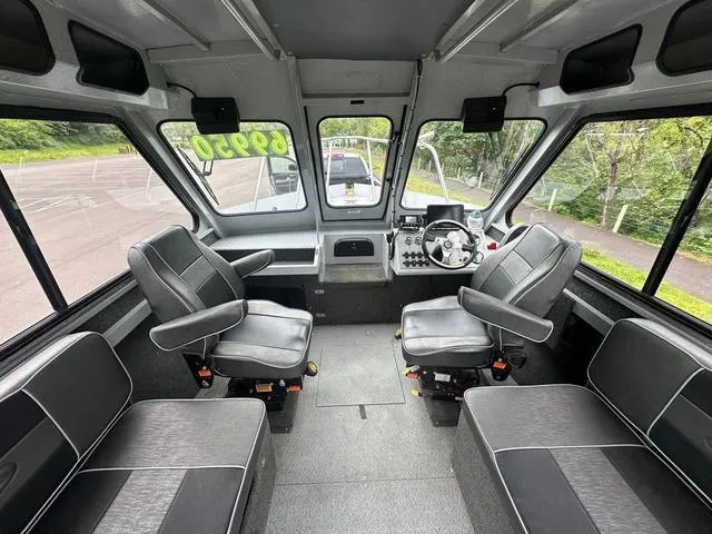 Slide: The Image of Interior of a 2017 Duckworth Pacific Pro 22' boat with seating and control panel. - 4