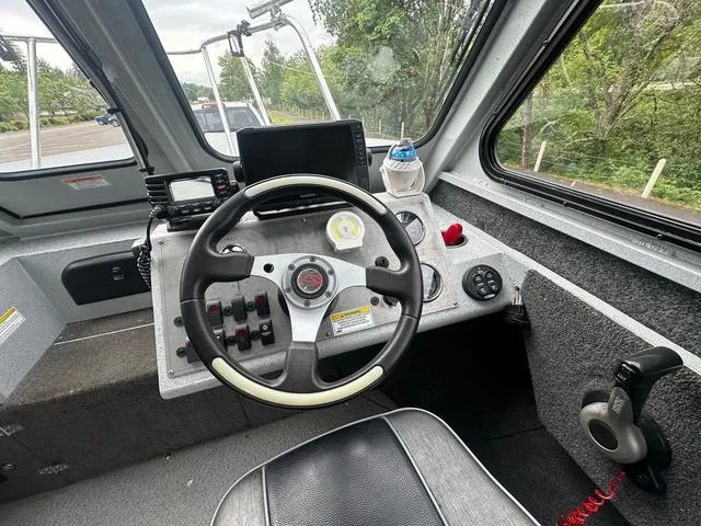 Slide: The Image of 2017 Duckworth Pacific Pro 22' boat cockpit with steering wheel and navigation equipment. - 5