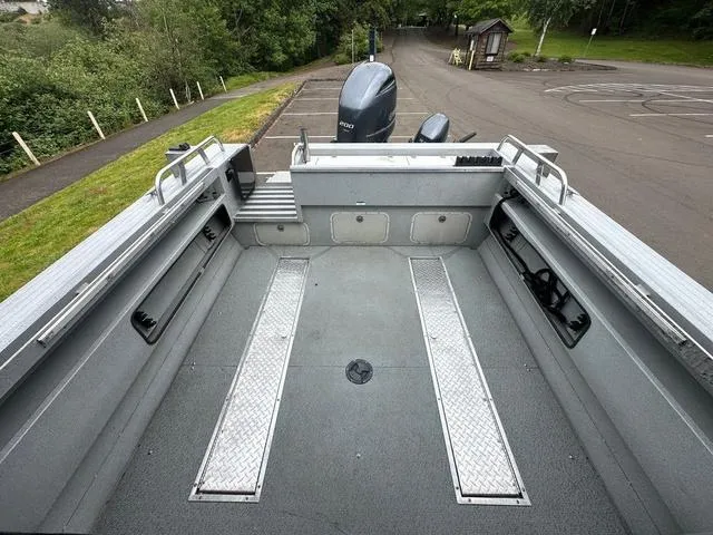 Slide: The Image of 2017 Duckworth Pacific Pro 22' boat interior with spacious deck and storage compartments. - 8