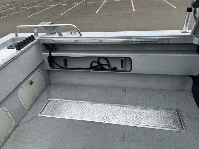 Slide: The Image of Interior of a 2017 Duckworth Pacific Pro 22' boat, showing storage and seating area. - 9